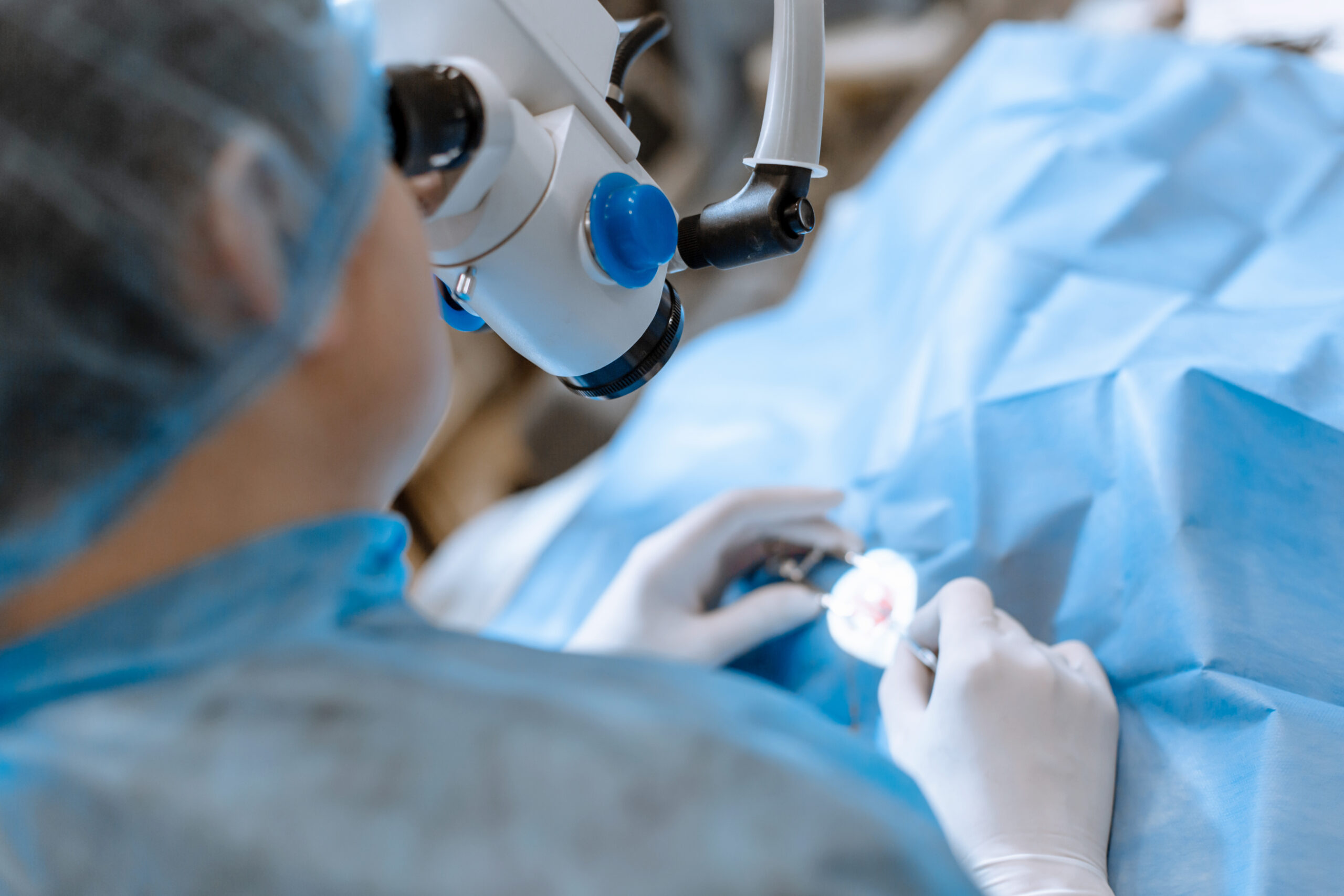 A professional ophthalmologist performs eye surgery with a micro