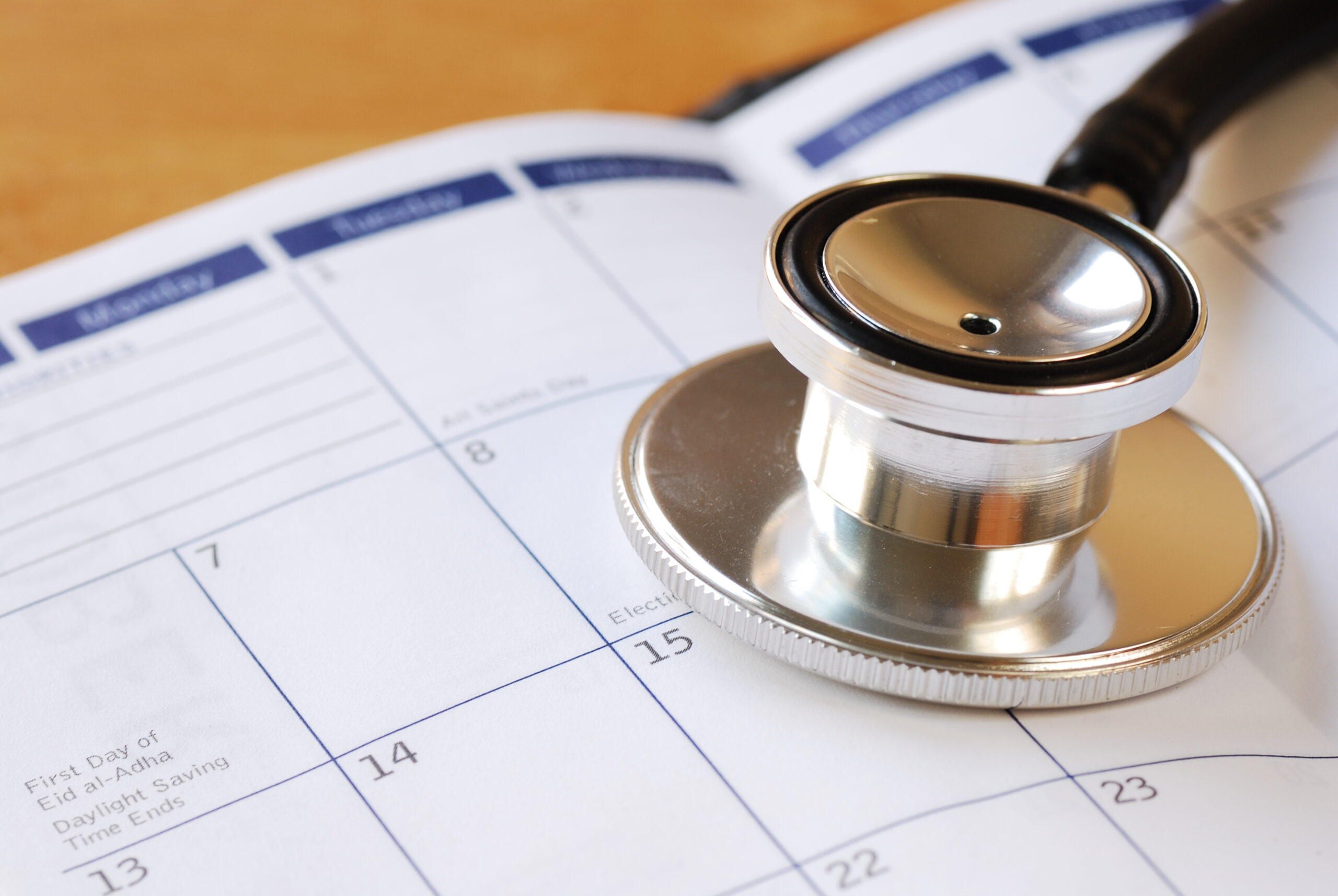 A stethoscope on the calendar concepts of medical appointment